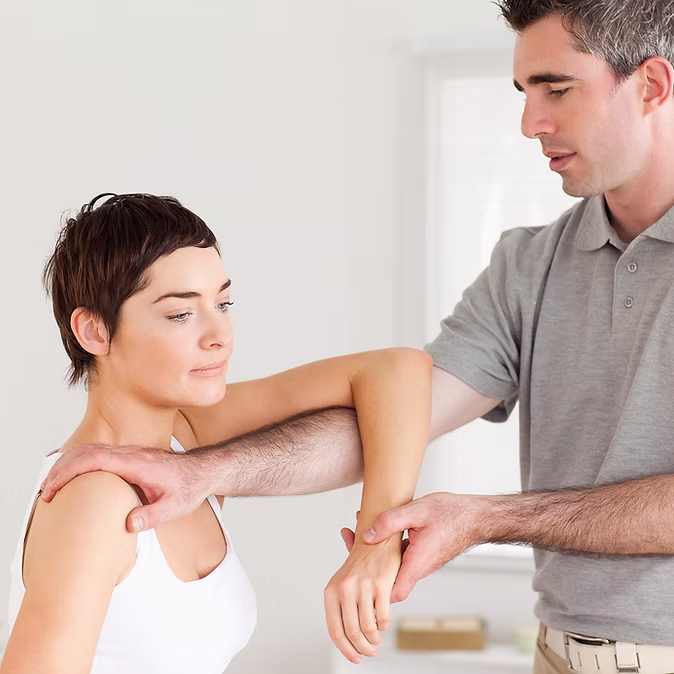 Caregiver assisting a patient with movement